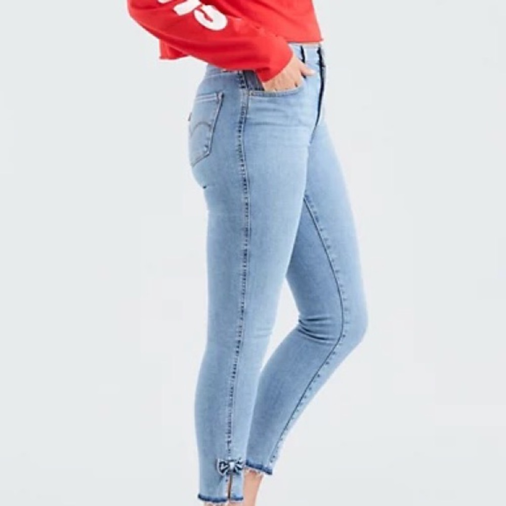 Levi’s light wash jeans with bows